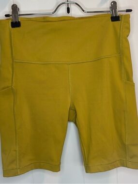 Athleta Mustard Yellow Biker Ultimate Stash Pocket 7" Short Gorpcore Athleisure